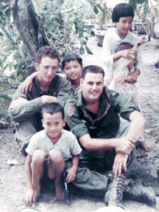 David with a friend and Vietnamese children